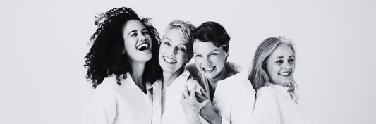 4 women laughing about skincare and life